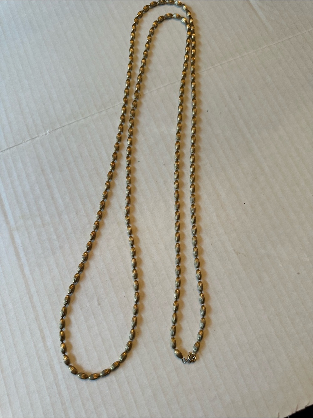 Goldtone 60 in beaded necklace